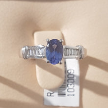 Load image into Gallery viewer, 0.71ct Oval Cut Tanzanite | 0.20cts Emerald Cut Diamonds | Designer Ring | 18kt White Gold
