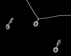 1.71cts [3] Oval Cut Green Emeralds | 0.60cts [96] Round Brilliant Cut Diamonds | Designer Halo Necklace and Drop Earring Set | 18kt White Gold