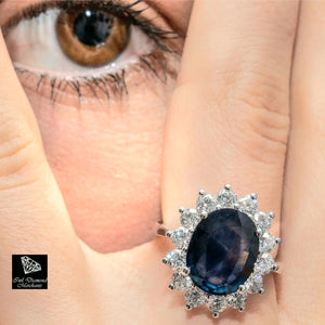 5.92cts Oval Cut Blue Sapphire | 1.57cts [14] Round Brilliant Cut Diamonds | Designer Diana Ring | 18kt White Gold