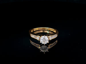 0.60ct Round Brilliant Cut Diamond | 0.10cts [8] Round and Baguette Cut Diamonds | Designer Ring | 18kt Yellow Gold