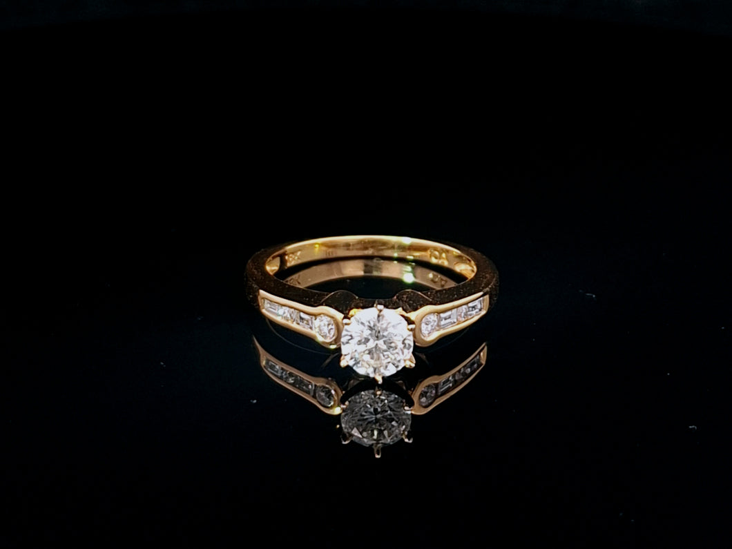 0.60ct Round Brilliant Cut Diamond | 0.10cts [8] Round and Baguette Cut Diamonds | Designer Ring | 18kt Yellow Gold