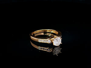 0.60ct Round Brilliant Cut Diamond | 0.10cts [8] Round and Baguette Cut Diamonds | Designer Ring | 18kt Yellow Gold