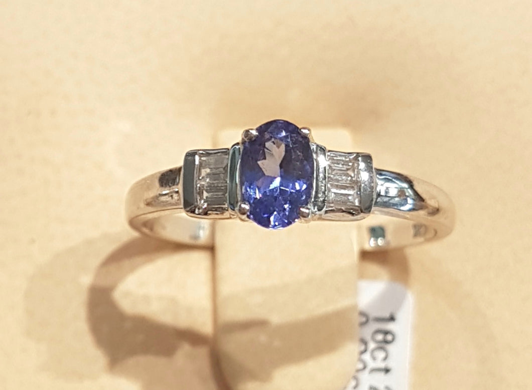 0.30ct Oval Cut Tanzanite Centre | 0.10cts Baguette Cut Diamonds | Designer Ring | 18kt White Gold