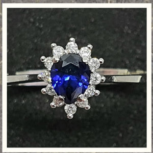 0.40cts Pear Cut Diffused Sapphire | 0.10cts [12] Round Brilliant Cut Diamonds | Designer Ring | 14kt White Gold