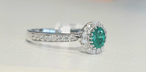 0.35ct Oval Cut Green Emerald | 0.30cts [30] Round Brilliant Cut Diamonds | Halo Design Ring | 18kt White Gold