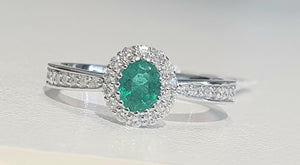 0.35ct Oval Cut Green Emerald | 0.30cts [30] Round Brilliant Cut Diamonds | Halo Design Ring | 18kt White Gold