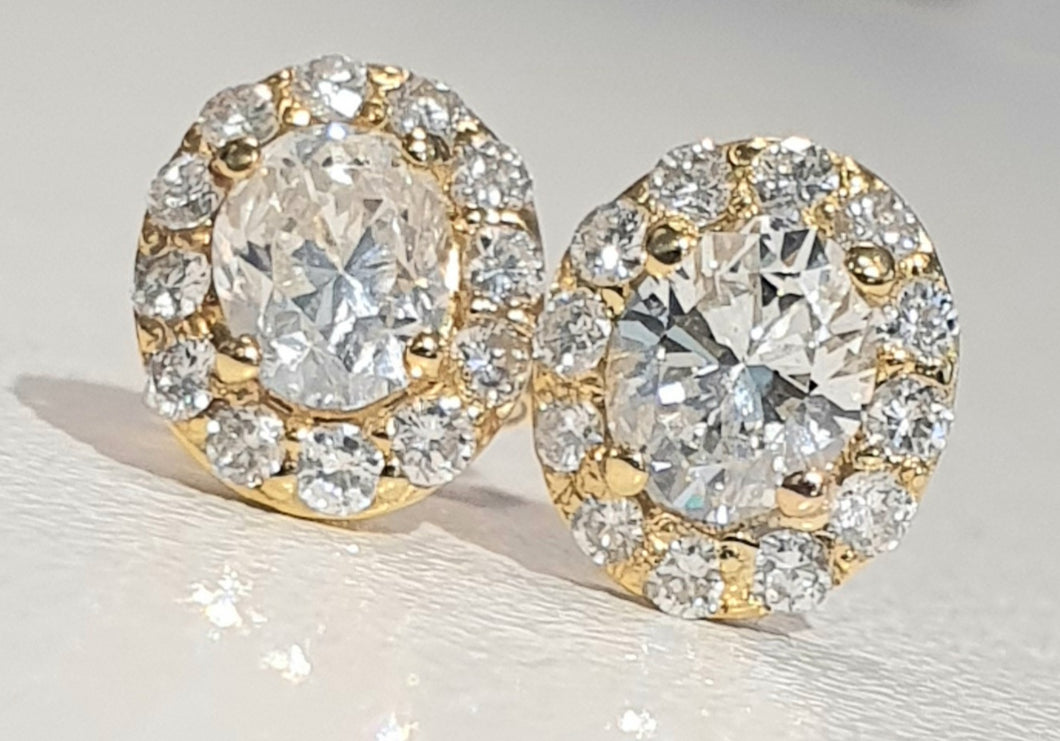 0.357ct + 0.368ct Oval Cut Certified Diamond Centres | 0.32cts [24] Round Brilliant Cut Diamonds | Halo Design Earrings | 18kt Yellow Gold