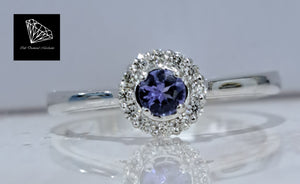 0.15ct Round Cut Tanzanite | 0.10cts [12] Round Brilliant Cut Diamonds | Halo Ring | 9kt White Gold